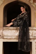 Nureh Maya Lawn Jacquard NJ-106 in black with embroidered jacquard shirt, chiffon dupatta, and cotton trouser.