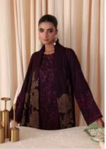 Model wearing maroon embroidered leather peach suit with jacquard shawl from Dastaan By Riaz Arts DS-01 winter collection.