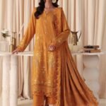 Model wearing mustard embroidered leather peach suit with jacquard shawl from Dastaan By Riaz Arts | DS-02 winter collection.