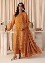 Model wearing mustard embroidered leather peach suit with jacquard shawl from Dastaan By Riaz Arts | DS-02 winter collection.