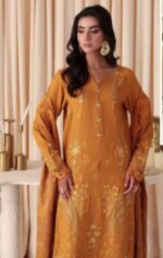Model wearing mustard embroidered leather peach suit with jacquard shawl from Dastaan By Riaz Arts | DS-02 winter collection.