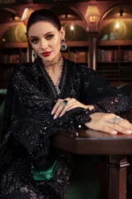 luxurious Maria B Winter Luxe 2025 WL-1307, an elegant black embroidered linen suit with velvet appliques and a plush palachi dupatta.
